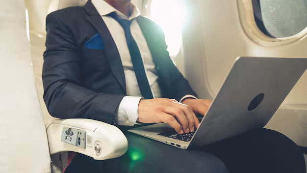 young-businessman-using-laptop-computer-airplane_31965-8556